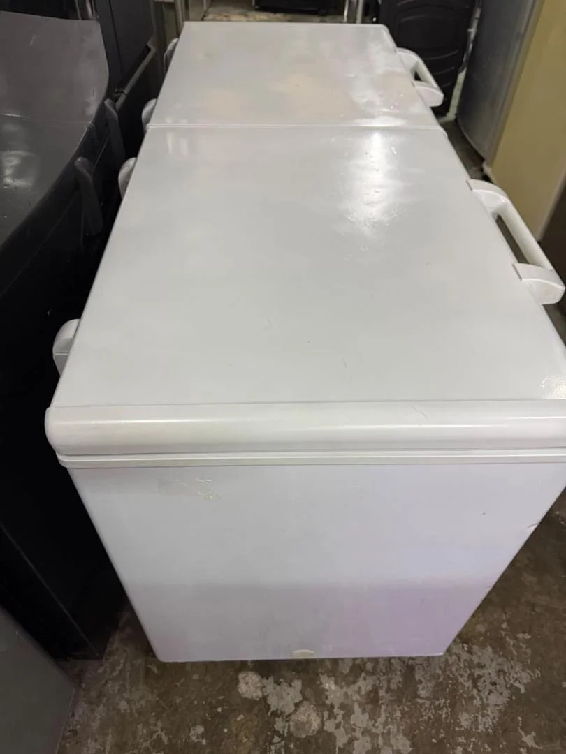 White chest freezer with closed lids in the appliance workshop